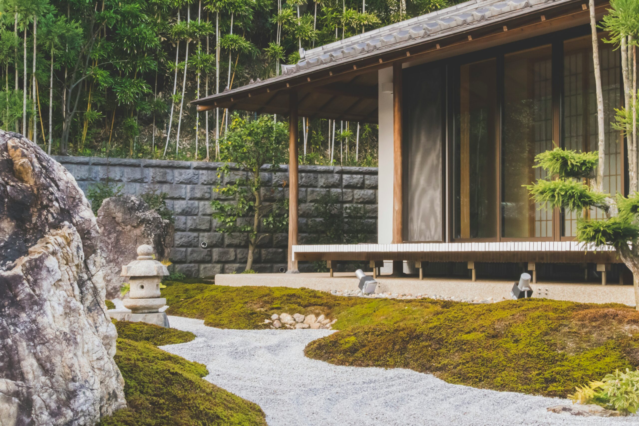 Zen-inspired Japanese garden and traditional house, symbolizing the balance of design and cultural context in localizing products for the Japanese market